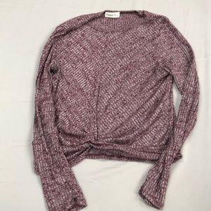 Long sleeve, scoop neck top with ruched front.